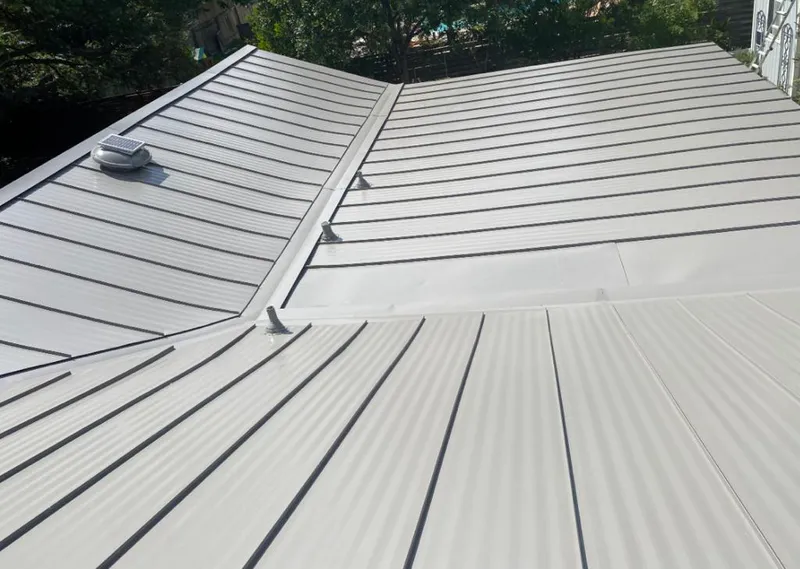 Solar attic fan installed on a metal roof for Roof Ventilation in Steilacoom